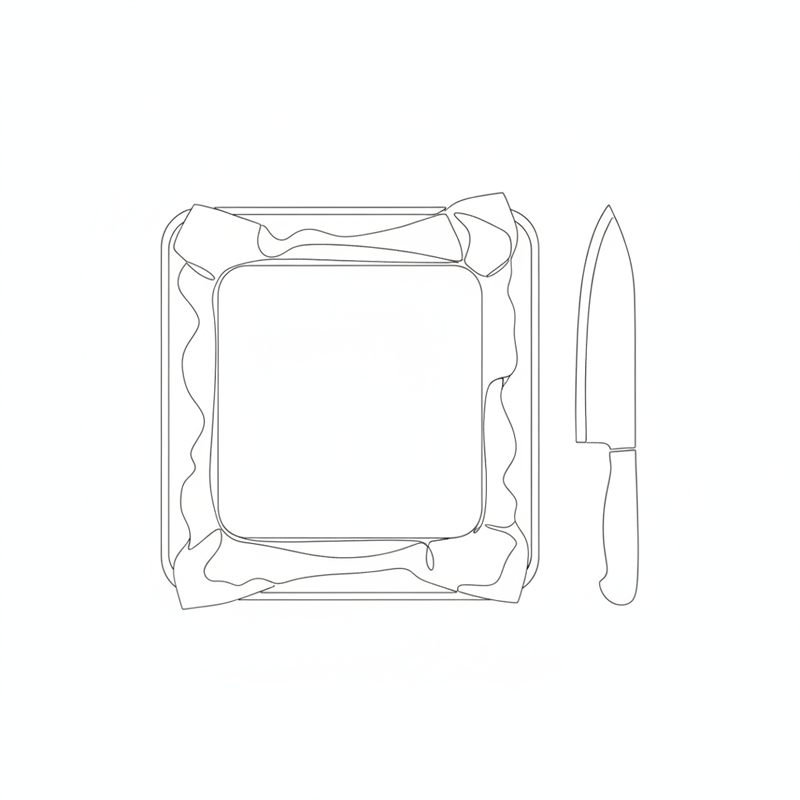 Illustration: en platta nougat i en fyrkantig form med en kniv bredvid