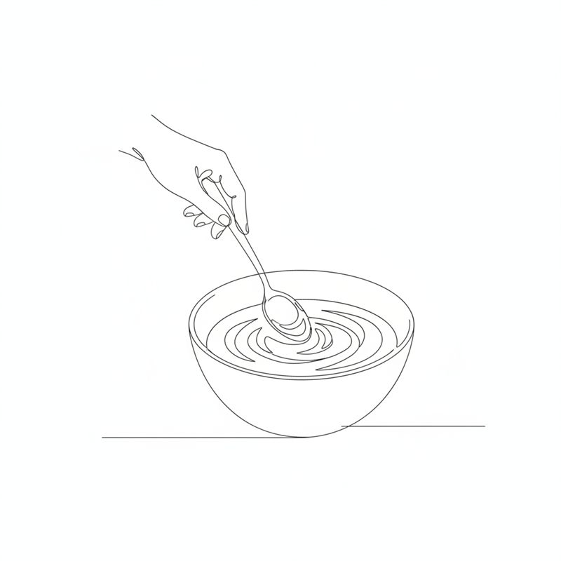 Illustration: en hand rör runt i en skål med en sked tills dressingen är krämig